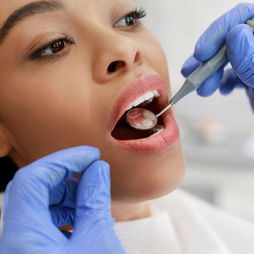 Woman having her teeth checked